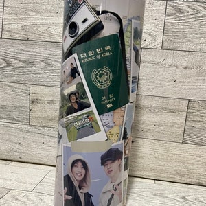 May include: A white travel tumbler with a collage of images, including a passport, a camera, and photos of people. The text "대한민국 REPUBLIC OF KOREA" is visible on the passport.