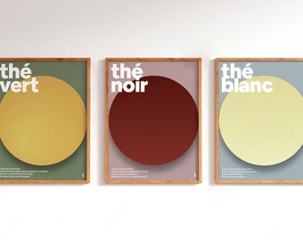 May include: Three framed posters with a minimalist design. Each poster features a large circle in a different color: yellow, red, and light yellow. The text "thé vert", "thé noir", and "thé blanc" is printed in white on each poster.