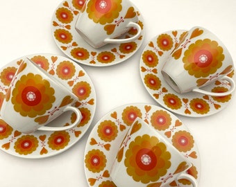 HACKEFORS.  "POP" Set of 4 tea cups and saucers.