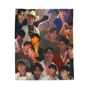 May include: A white blanket with a repeating pattern of images of a young man. The images show the man in different outfits and poses, including wearing a cowboy hat and holding a phone. The blanket has a soft texture.