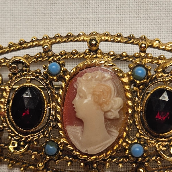 Vintage Florenza gold Brooch. Cameo with red and blue stones.