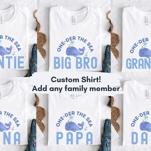 May include: Six white t-shirts with a blue whale graphic and the text "One-der the Sea" with a different family member title on each shirt: Auntie, Big Bro, Grandma, Nana, Papa, and Dada.
