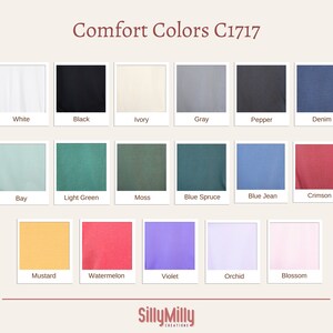 May include: A colour chart displaying 15 different shades of Comfort Colors C1717 fabric. The colours are: White, Black, Ivory, Grey, Pepper, Denim, Bay, Light Green, Moss, Blue Spruce, Blue Jean, Crimson, Mustard, Watermelon, Violet, Orchid, and Blossom.