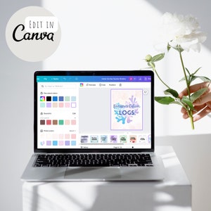 May include: A laptop screen displaying a Canva design for a teacher binder. The design features a coral reef with the text "Documentation Logs" in a blue and purple font.