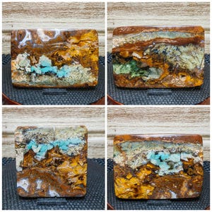 May include: Four polished agate slices with a variety of colors and patterns, including brown, yellow, blue, and green. The agate slices are arranged in a grid pattern on a wooden surface.