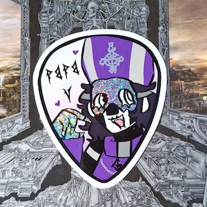 May include: A sticker featuring a cartoon character in a purple and white bishop's hat and collar. The character has a glittery mask and is pointing. The word "Papa" is written in stylized letters.