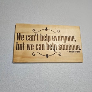We can&#39;t help everyone, but we can help someone.&quot; , by Ronald Reagan Aspen Golden Pecan Stain wood Handrubbed Urethane Gloss Sign