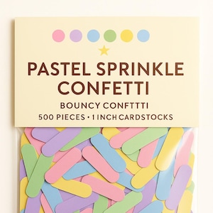May include: A clear plastic bag filled with pastel-colored confetti. The confetti is in the shape of elongated rectangles in shades of pink, yellow, green, blue, and purple. The packaging reads "PASTEL SPRINKLE CONFETTI" and "500 PIECES • 1 INCH CARDSTOCKS".