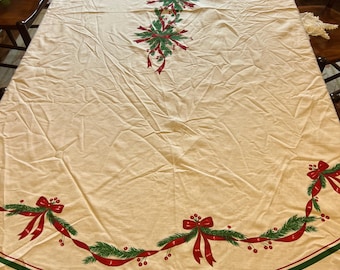 White Poly Blend Oval Christmas Tablecloth with Ribbons, Greens, Holly Berries | 61" x 80"