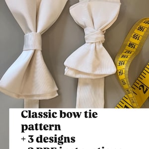 May include: Two ivory bow ties are displayed against a gray background, with a yellow measuring tape on the right. The text on the image reads "Classic bow tie pattern + 3 designs + 2 PDF instructions."
