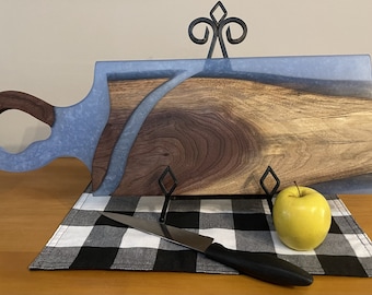 Handcrafted live edge black walnut with blue epoxy cutting board.  Dimensions 25" x 8 1/2"