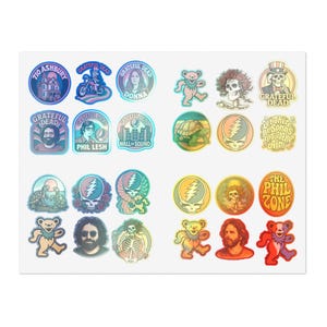 May include: A selection of vibrant stickers showcasing Grateful Dead designs. The stickers feature the band's logo, dancing bears, portraits of band members, and other iconic symbols. The stickers are round and rectangular, with various colours and text.