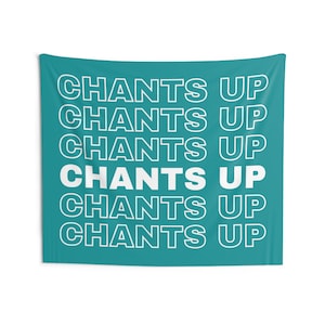 May include: A teal blue tapestry with the text "CHANTS UP" repeated six times in white.