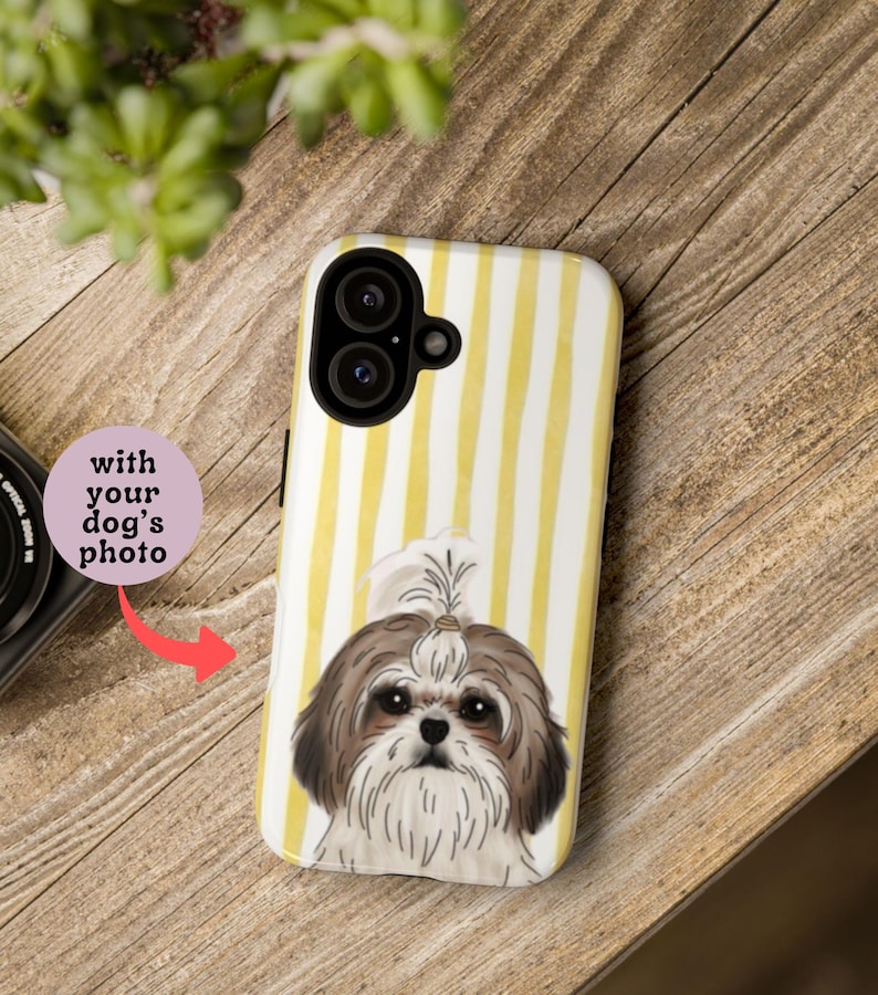 May include: A white and yellow striped phone case featuring a Shih Tzu dog illustration. The case has a camera cutout and the text "with your dog's photo". The dog has brown and white fur.