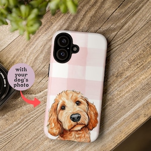 May include: A white and pink plaid phone case featuring a watercolor illustration of a golden doodle dog. The case has a dual-lens camera cutout and the text "with your dog's photo".