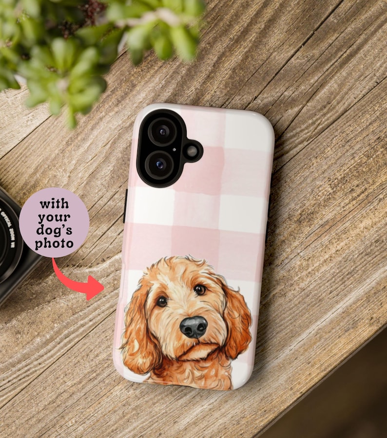 May include: A white and pink plaid phone case featuring a watercolor illustration of a golden doodle dog. The case has a dual-lens camera cutout and the text "with your dog's photo".