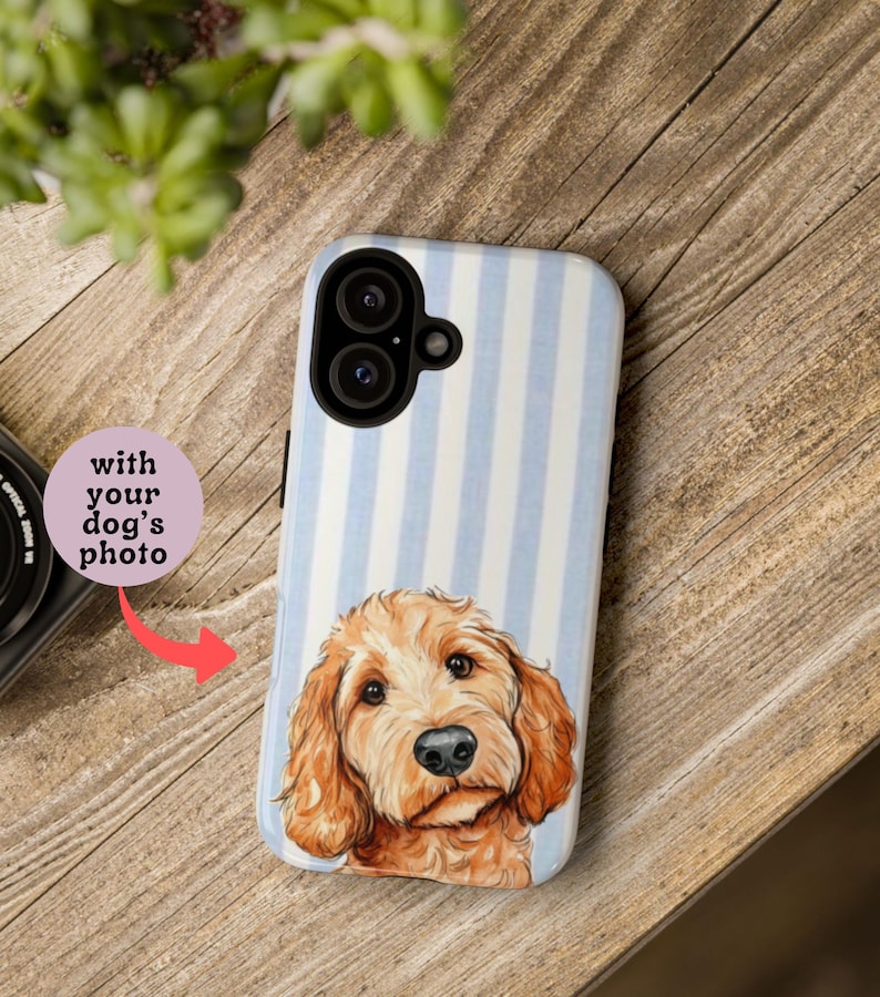 May include: A phone case featuring a light blue and white striped pattern with a portrait of a golden-brown dog. The text "with your dog's photo" is displayed on a pink circle.