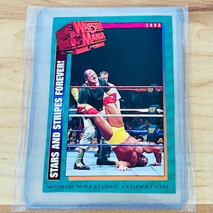 May include: A wrestling trading card featuring a wrestler in yellow trunks and a red and white glove, mid-match in a wrestling ring. The card has the text "WrestleMania" and "Stars and Stripes Forever!" with "World Wrestling Federation" at the bottom.