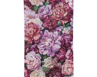 May include: A kitchen towel with a floral pattern featuring pink, purple, and burgundy peonies.