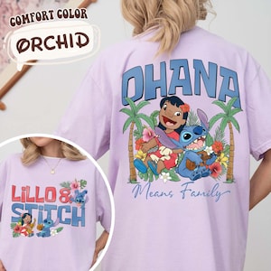 May include: Orchid-colored t-shirts with a graphic of Lilo & Stitch. One shirt features the word "OHANA" above an image of Lilo and Stitch with palm trees and flowers. The other shirt has "LILLO & STITCH" printed on it.