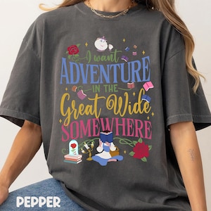 May include: Dark gray t-shirt with the text "I want Adventure in the Great Wide Somewhere." The graphic includes a rose, books, and a character reading. The word "Pepper" is printed at the bottom.