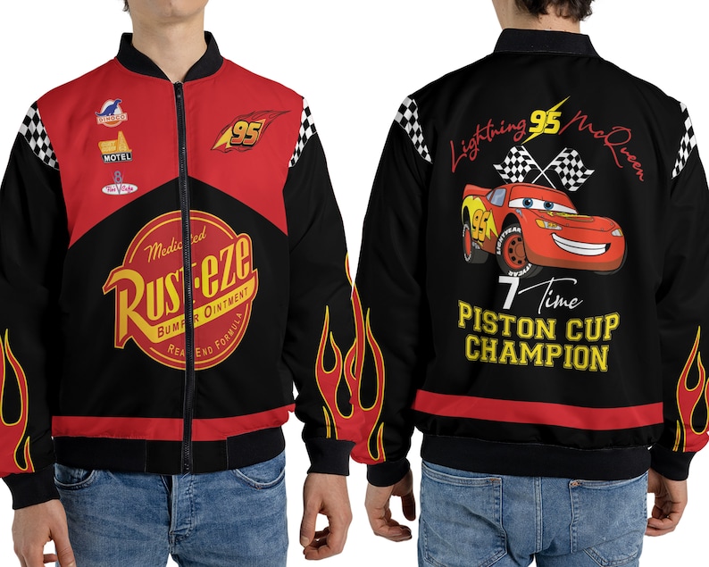 May include: Black bomber jacket with red accents and a Cars character design. The jacket features the text "Lightning 95 McQueen", "7 Time Piston Cup Champion", and "Medicated Rust-eze Bumper Ointment Real End Formula".