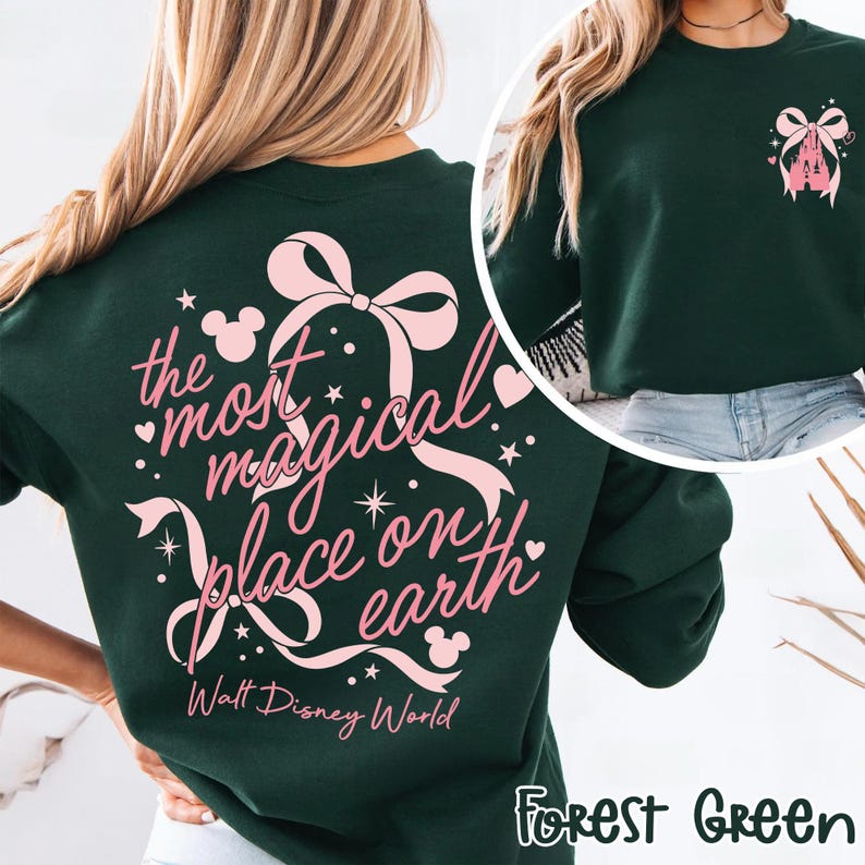 May include: Forest green sweatshirt with a pink bow and castle graphic. The back features the text "the most magical place on earth" with Mickey Mouse icons and the words "Walt Disney World".