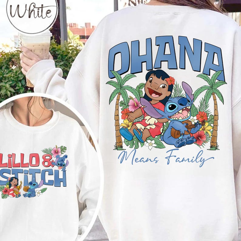May include: White sweatshirt featuring the words "OHANA Means Family" in blue, with a graphic of Lilo and Stitch surrounded by palm trees and flowers. A smaller graphic on the front shows Lilo and Stitch with the words "Lilo & Stitch".