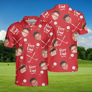 May include: Red polo shirt with a golf theme. The shirt features a pattern of golf balls, crossed golf clubs, and children's faces. Text on the shirt reads "Best Dad by Par" and "Dad by Par".