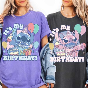 May include: Two t-shirts, one purple and one charcoal, each featuring a cartoon character with a birthday cake, balloons, and the text "It's My Birthday!". The character is wearing a party hat.