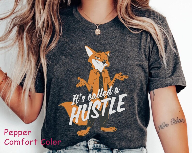 May include: A gray t-shirt with a cartoon fox wearing a tie and the text "It's called a hustle".