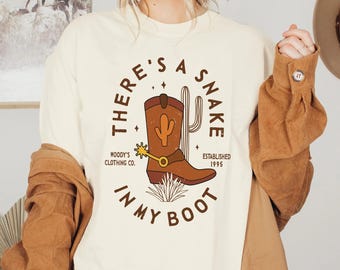 Vintage Woody Cowboy There's A Snake In My Boot Comfort Colors Shirt, Toy Story T-shirt, Disney Western Cowboy Shirt, Disneyland Family Trip