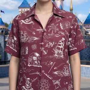 May include: A set of three ceramic mugs with a speckled, cream-colored glaze. Each mug features a different hand-painted floral design in shades of blue, green, and yellow. The mugs have a simple, rounded shape and a comfortable handle.