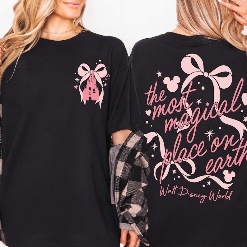 May include: Black t-shirt with a pink castle and bow graphic on the front. The back of the shirt features the text "the most magical place on earth" with a bow and Mickey Mouse silhouettes. Walt Disney World is printed below.