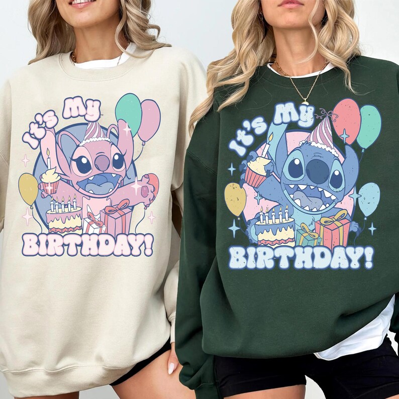 May include: Two sweatshirts, one beige and one dark green, each featuring a cartoon character with a party hat, balloons, and a birthday cake. The text "It's My Birthday!" is printed below the character.