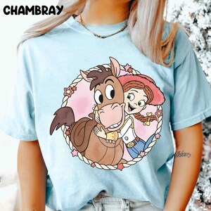 May include: A rustic wooden sign with the text "Welcome to our home" in white lettering. The sign features a distressed finish and a simple, inviting design, perfect for entryway decor.