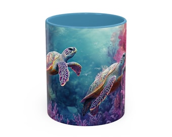May include: A ceramic mug featuring a vibrant underwater scene with two sea turtles swimming near coral. The mug has a light blue interior and a white exterior. The turtles are detailed with shades of green, purple, and orange.