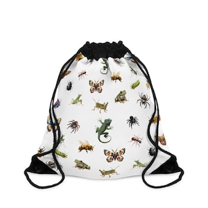 May include: White drawstring bag with a colorful pattern of insects, butterflies, frogs, and lizards.