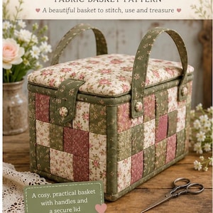 May include: A rectangular fabric basket with a woven-style patchwork design in shades of sage green, dusty rose, and cream floral prints. It features two upright fabric handles, a padded lid with a button closure, and matching fabric buttons.