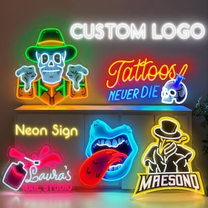 Pode incluir: Uma cole&ccedil;&atilde;o de letreiros de neon com uma caveira de chap&eacute;u, o texto Tattoos Never Die com uma caveira, um letreiro Laura's Nail Studio com esmalte, uma boca com l&iacute;ngua e um m&eacute;dico da peste com o texto MAESONO.