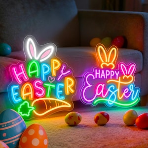 May include: Two neon signs saying "Happy Easter" in bright colours, shaped like a bunny and carrot. Easter eggs in various colours are scattered around the signs, creating a festive holiday display.