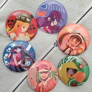 May include: Six colorful round pins with different cartoon characters. The pins feature a girl with purple hair, a girl with green hair, a girl with brown hair, a girl with red hair, a girl with yellow hair, and a girl with blue hair.