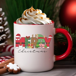 May include: White ceramic mug with a red rim and handle. The mug features a festive design with the word "Merry" spelled out in colourful letters, each letter decorated with a different Christmas character. The word "Christmas" is written in black script below the letters.
