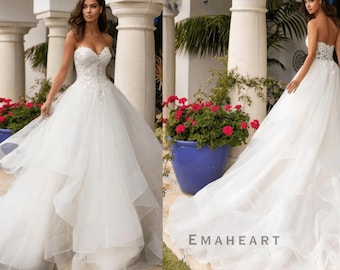 Prachtige backless prinses bruidsbaljurk met kralen met lovertjes, kanten applicaties, gezwollen organza rok