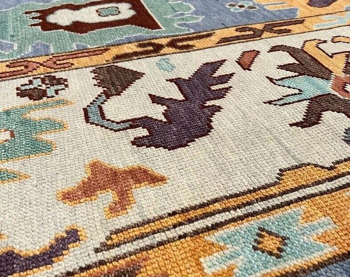 Hand Knotted Oushak Wool Rug: Blue, Ivory, & Natural Dyes