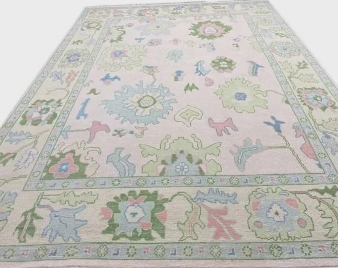 Hand Knotted Oushak Style Wool Rug: Pink, Beige, and Green Floral Design