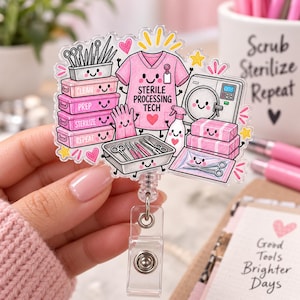 May include: A clear acrylic badge reel featuring a cartoon illustration of a pink scrub top with the text STERILE PROCESSING TECH, surrounded by smiling medical instruments, stacked trays labeled CLEAN, PREP, STERILIZE, REPEAT, and a sterilizer machine.