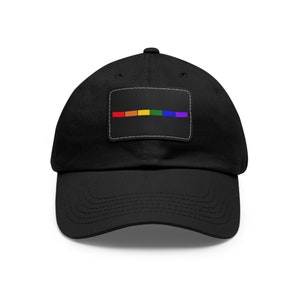 May include: A black baseball cap with a rainbow colored patch on the front. The patch has six horizontal stripes in the colors of the rainbow.