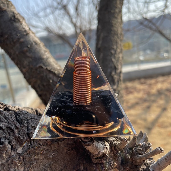 Copper wire surrounds transparent crystal double points Orgonite Pyramid - Obsidian rolling stone Healing Reiki Protection