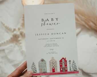 Könnte beinhalten: Eine weiße Babyparty-Einladung mit rotem und weißem gestreiftem Rand. Die Einladung zeigt eine Winterszene mit drei Häusern und zwei schneebedeckten Bäumen. Der Text auf der Einladung lautet: "Laden Sie sich zu einer Babyparty zu Ehren von Jessica Duncan ein Samstag, 16. September um 17:00 Uhr Sophie's House 256 White Street, San Diego, CA 12345 An Sophie unter 123-456-678".